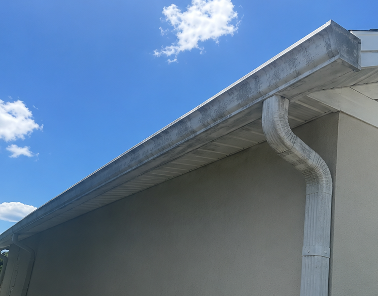 Gutter and soffit before soft washing by Sunshine Pressure Washing